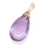 CARVED AMETHYST PENDANT in high carat yellow gold, comprising of a carved amethyst drop depicting an