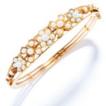 ANTIQUE PEARL BANGLE in high carat yellow gold, set with seed pearls in foliate motif, unmarked, 5.