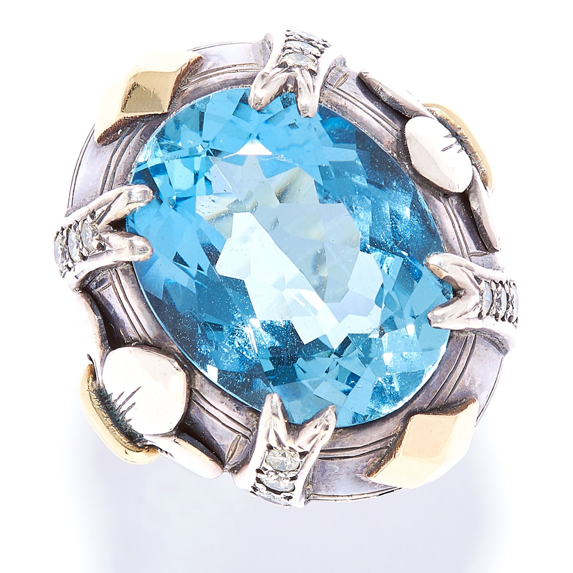 AQUAMARINE AND DIAMOND DRESS RING in gold or silver, set with an oval cut aquamarine in a