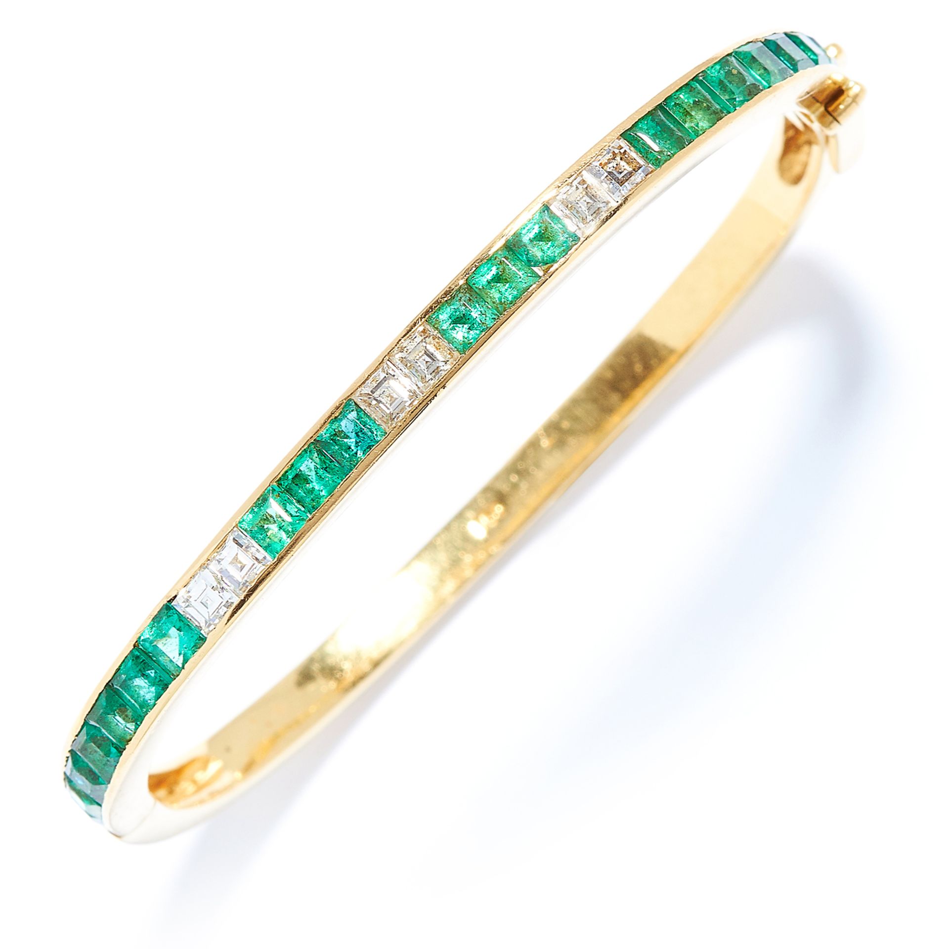 3.60 CARAT EMERALD AND DIAMOND BANGLE in 18ct yellow gold, set with square cut emeralds totalling
