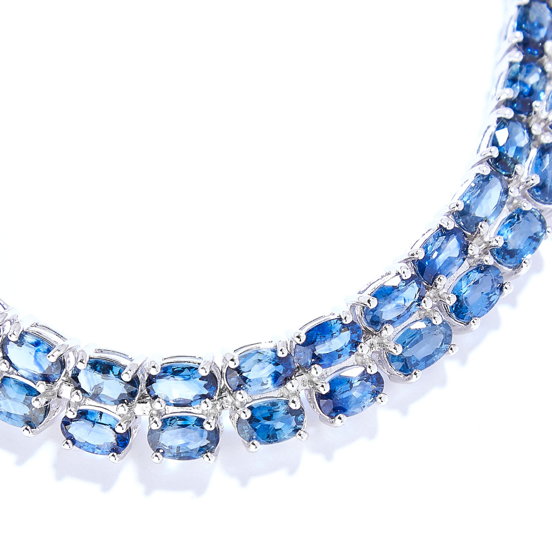 SAPPHIRE AND DIAMOND LINE BRACELET in sterling silver, comprising of two rows of oval cut - Image 2 of 2