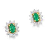 EMERALD AND DIAMOND CLUSTER EARRINGS in 18ct white gold, each set with an oval cut emerald in a