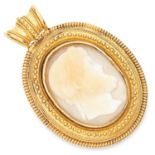 ANTIQUE CARVED CAMEO PENDANT in high carat yellow gold, in Etruscan revival form set with a carved