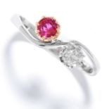 RUBY AND DIAMOND TOI ET MOI RING in platinum, set with a round cut ruby and diamond, stamped