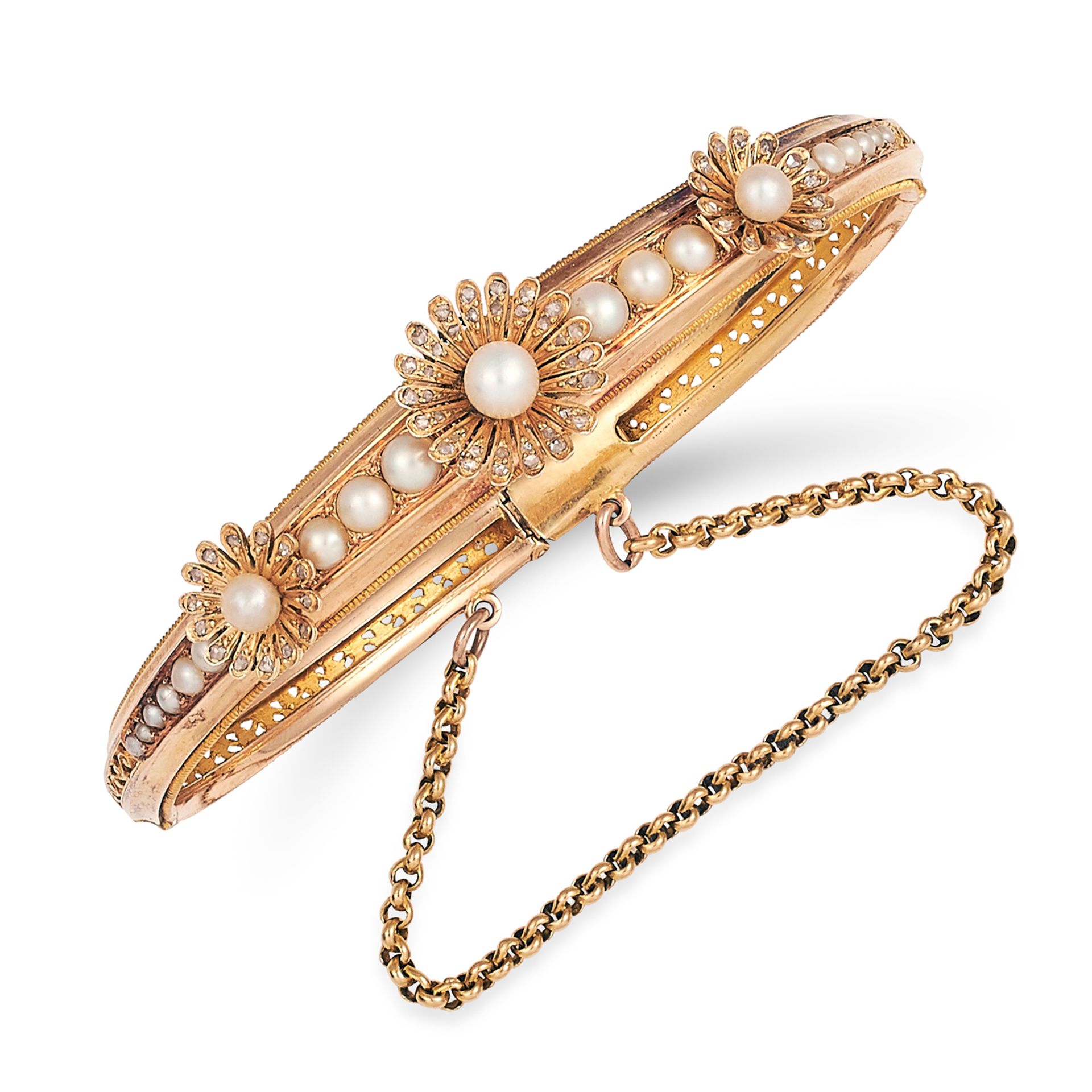 ANTIQUE VICTORIAN SEED PEARL AND DIAMOND BANGLE in high carat yellow gold, in foliate motif set with