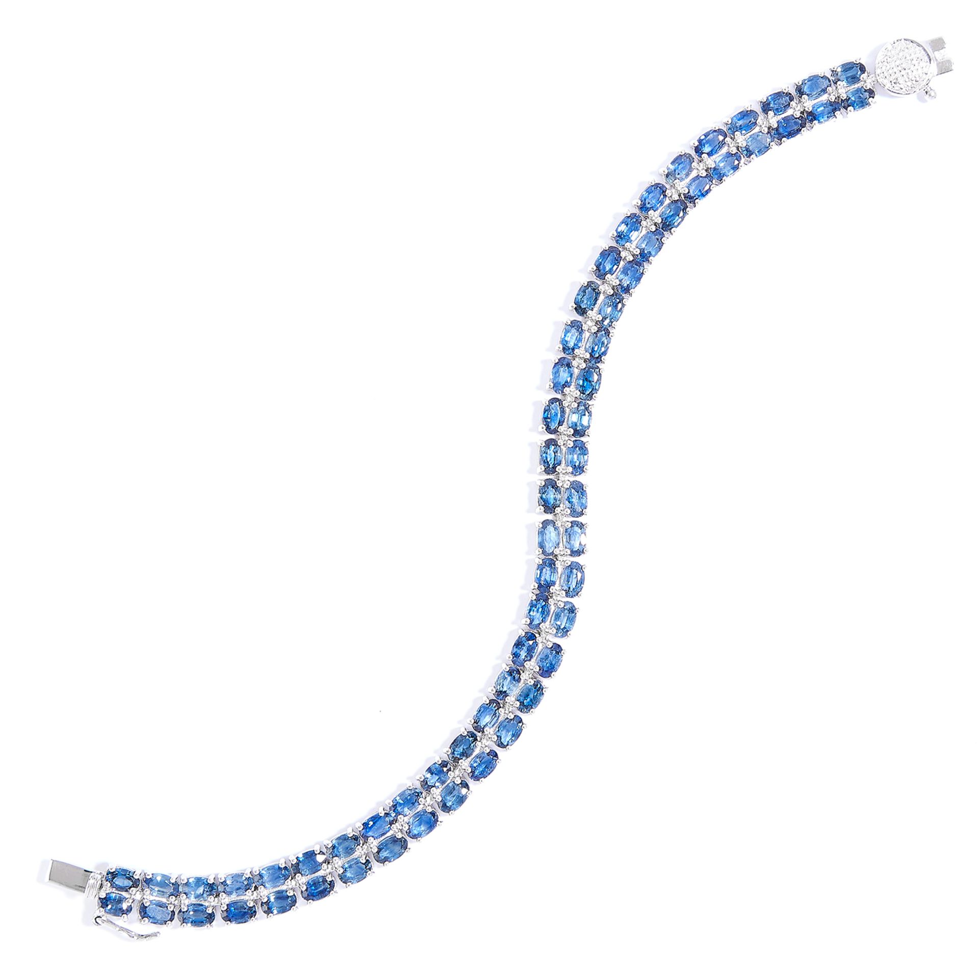 SAPPHIRE AND DIAMOND LINE BRACELET in sterling silver, comprising of two rows of oval cut