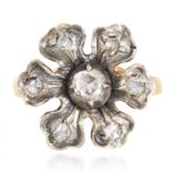 A DIAMOND RING in yellow gold, depicting a flower set with rose cut diamonds, unmarked, 4.52g.