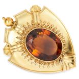 ANTIQUE VICTORIAN CITRINE BROOCH in high carat yellow gold, depicting a shield set with an oval