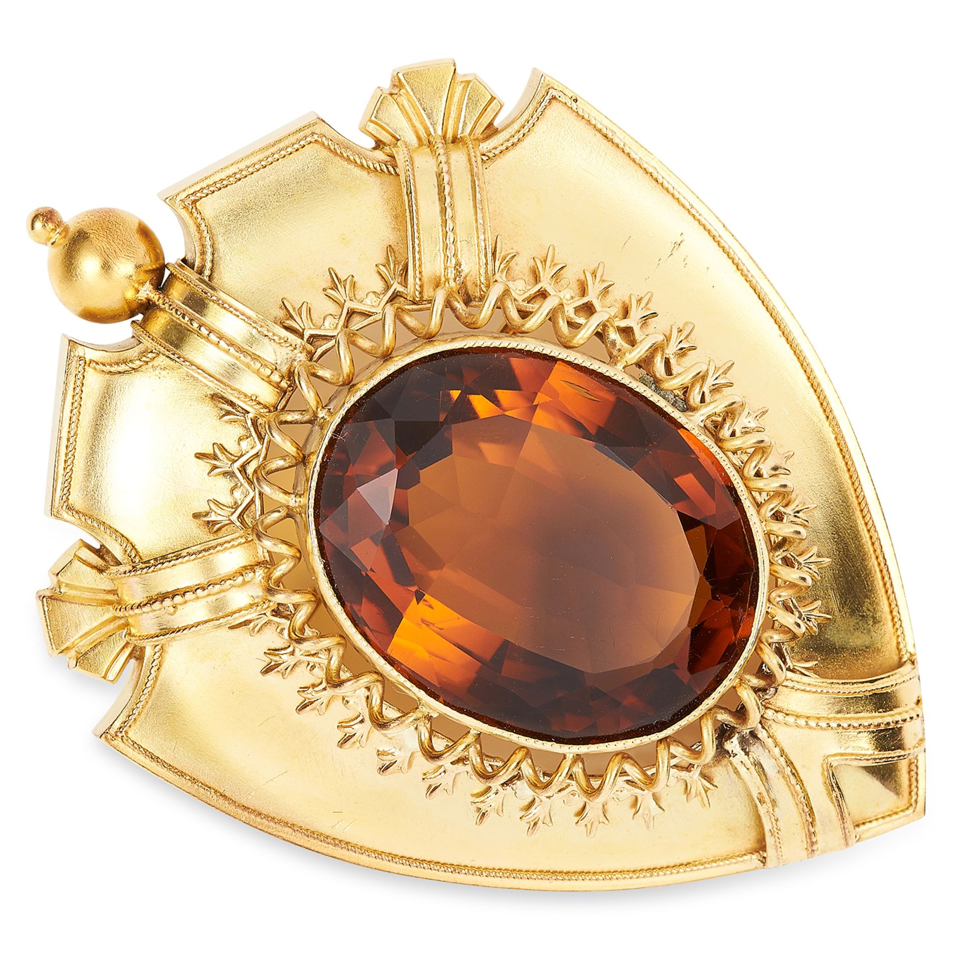 ANTIQUE VICTORIAN CITRINE BROOCH in high carat yellow gold, depicting a shield set with an oval