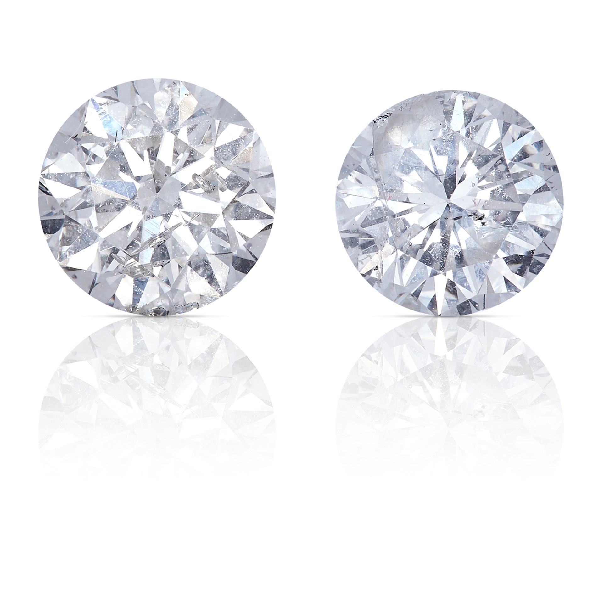 TWO ROUND CUT MODERN BRILLIANT DIAMONDS TOTALLING 1.56cts, UNMOUNTED.