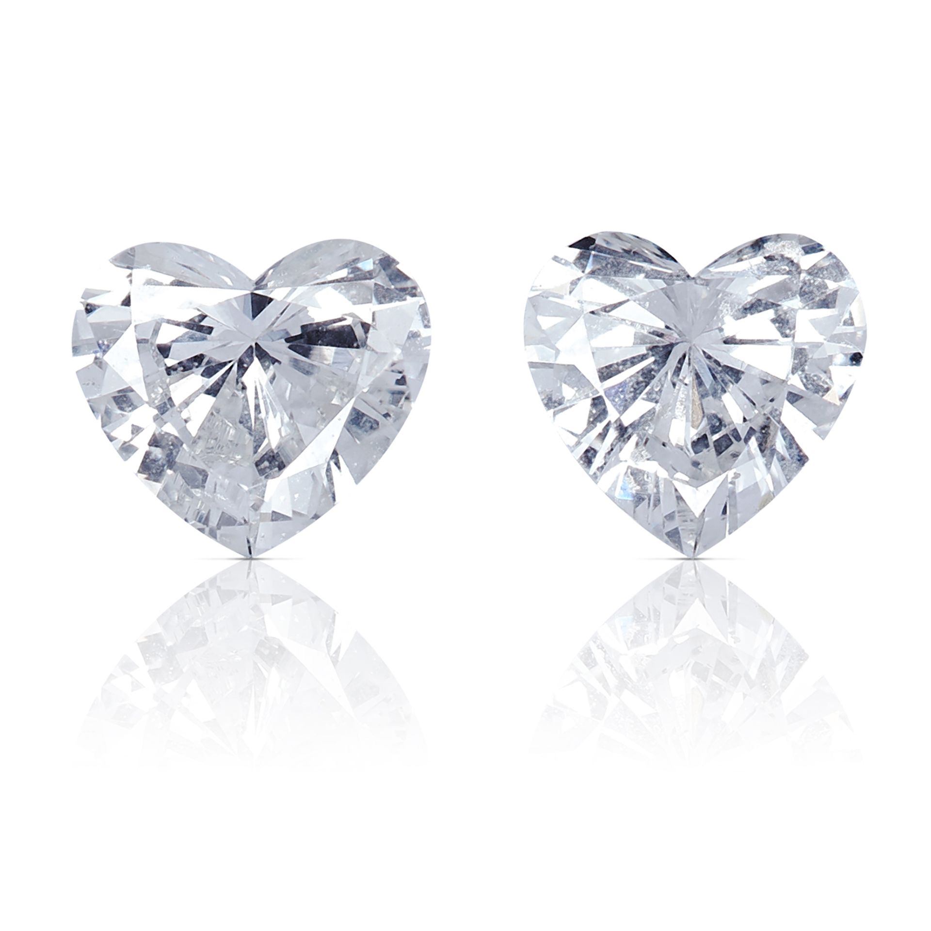 A PAIR OF HEART SHAPED BRILLIANT CUT DIAMONDS, TOTALLING 0.40cts, UNMOUNTED.