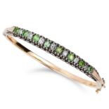 TWO ANTIQUE VICTORIAN PERIDOT AND DIAMOND BANGLES set with alternating oval cut peridots and old cut