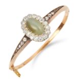 ANTIQUE CHRYSOPRASE AND DIAMOND BANGLE set with a cabochon cats eye chrysoprase and old cut diamonds