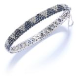 3.50 CARAT DIAMOND AND SAPPHIRE BANGLE set with round cut diamonds totalling approximately 3.50