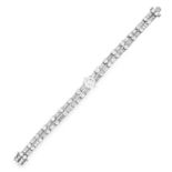 DIAMOND BRACELET set with two rows of round and baguette cut diamonds, with a principle round cut