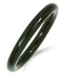 NEPHRITE JADE BANGLE comprising of a single piece of polished nephrite, 6.5cm inner diameter, 51.
