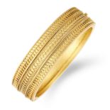 ANTIQUE GOLD BANGLE decorated in gold filigree design, 5.5cm, 25.1g.