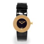 LADIES WRISTWATCH, CHANEL with black dial in gold border engraved with 'Chanel', on black strap,