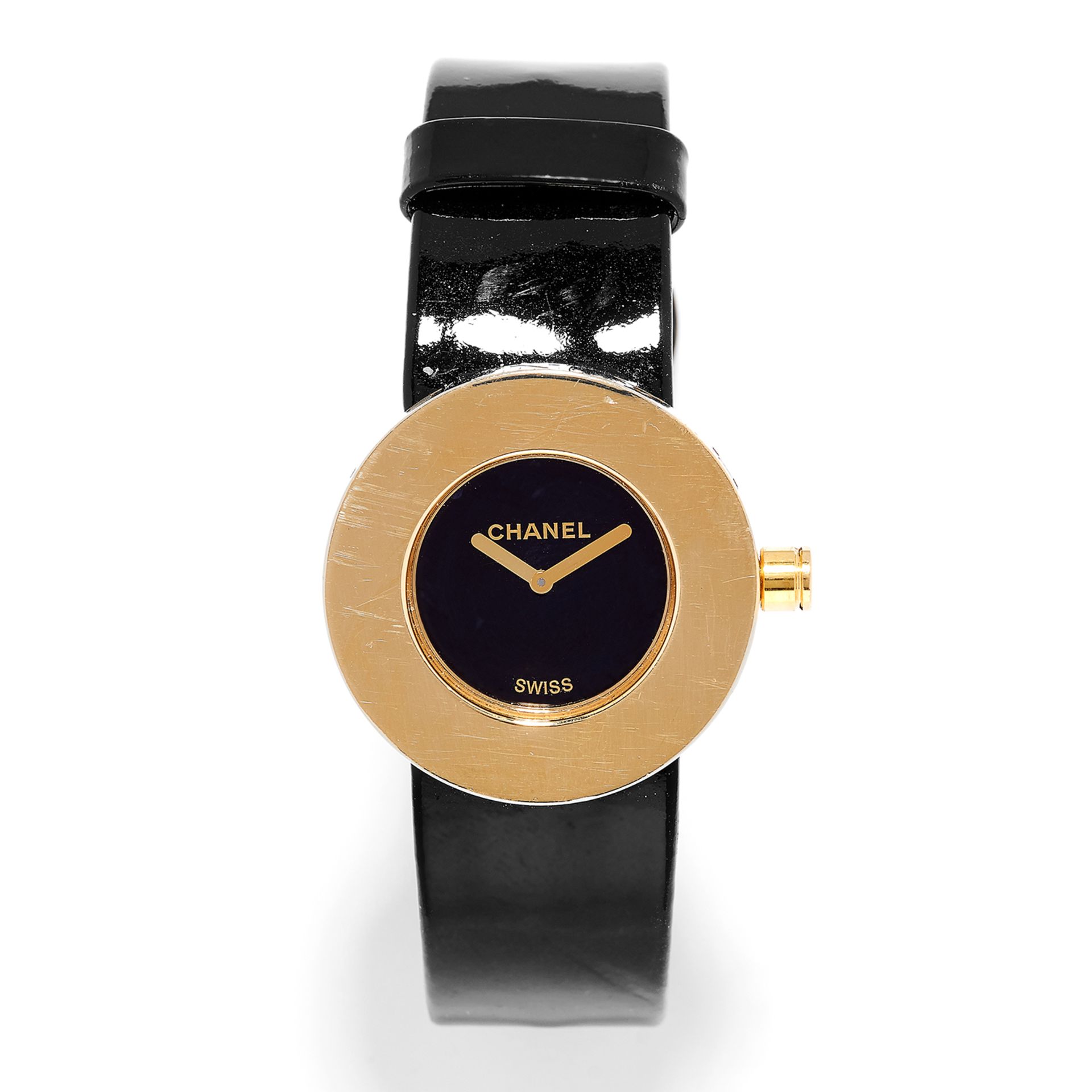 LADIES WRISTWATCH, CHANEL with black dial in gold border engraved with 'Chanel', on black strap,