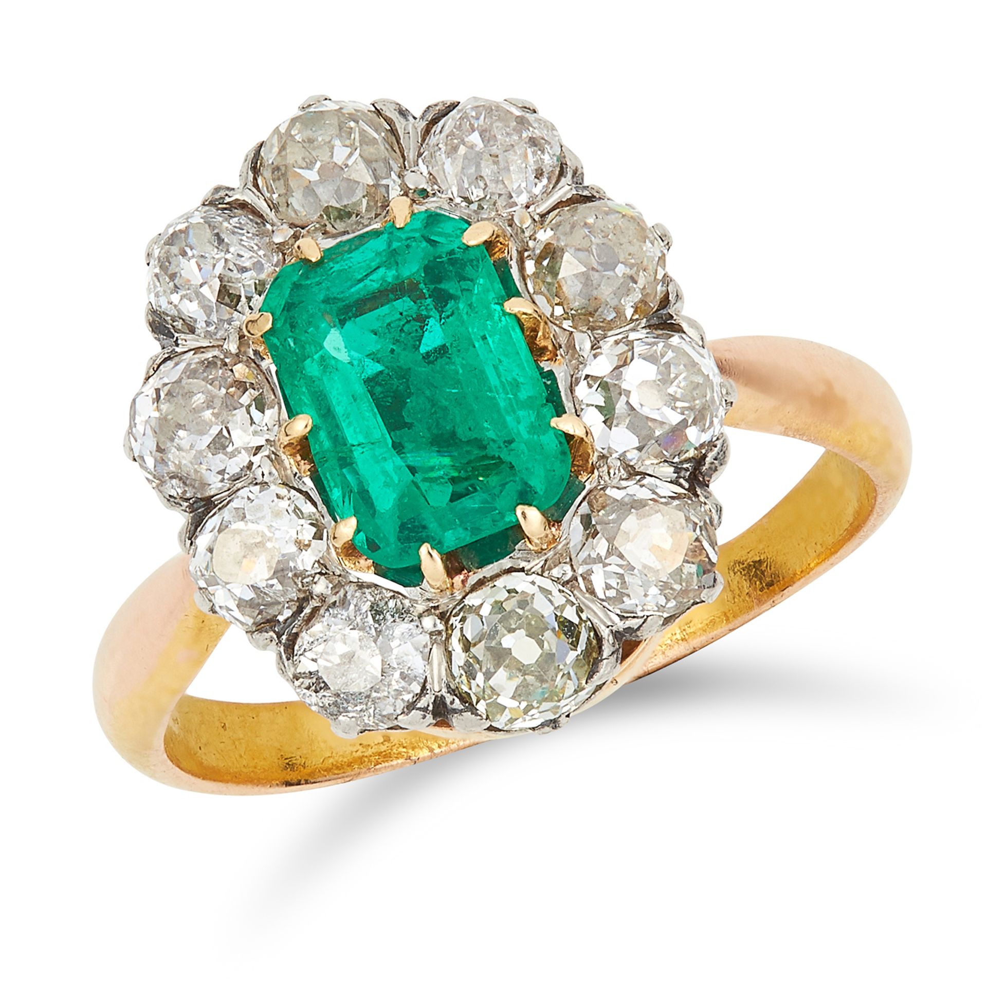 ANTIQUE COLOMBIAN EMERALD AND DIAMOND CLUSTER RING set with an emerald cut emerald of