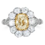 FANCY YELLOW DIAMOND CLUSTER RING, the oval cut fancy yellow diamond encircled in a cluster of round