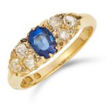 ANTIQUE SAPPHIRE AND DIAMOND RING set with an oval cut sapphire between old cut diamonds, size K /