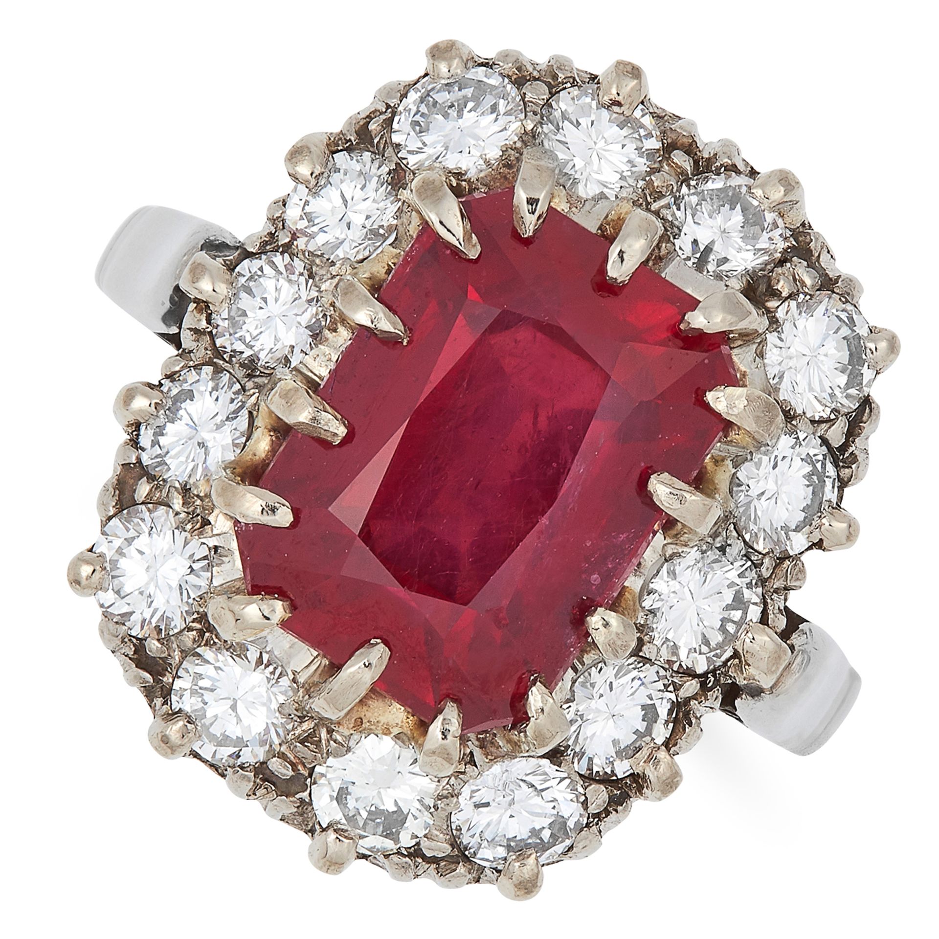 RUBY AND DIAMOND CLUSTER RING set with an emerald cut ruby of approximately 6.01 carats in a