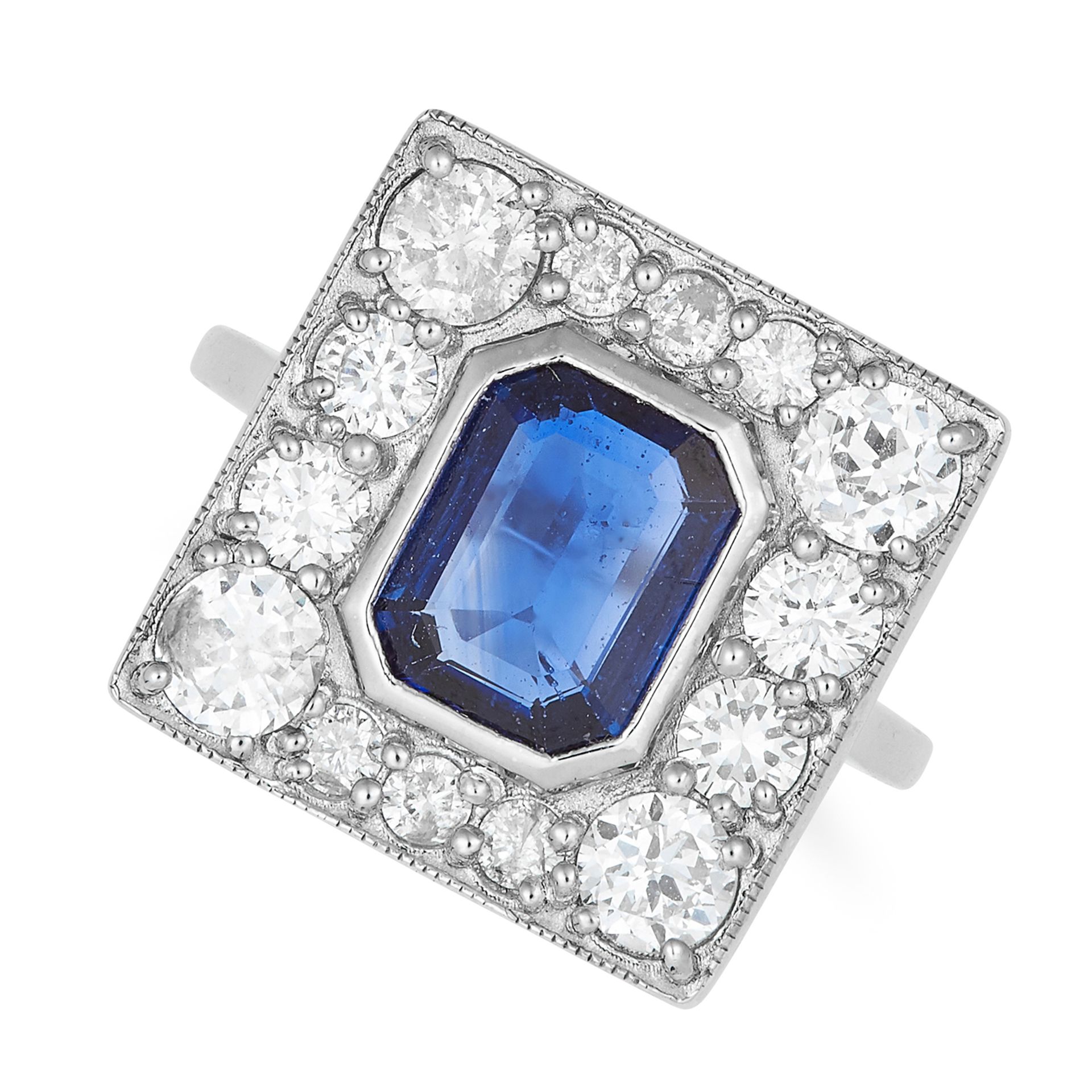 SAPPHIRE AND DIAMOND CLUSTER RING in Art Deco style, set with an emerald cut sapphire of