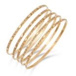 FIVE GOLD BANGLES, with textured design, inner diameter: 6.5cm, 24.7g.