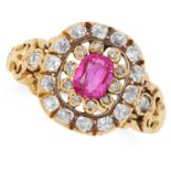 ANTIQUE RUBY AND DIAMOND CLUSTER RING set with an oval cushion cut ruby of approximately 0.80 carats