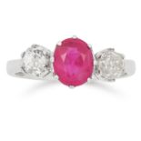 RUBY AND DIAMOND THREE STONE RING set with an oval cut ruby of approximately 1.10 carats between two