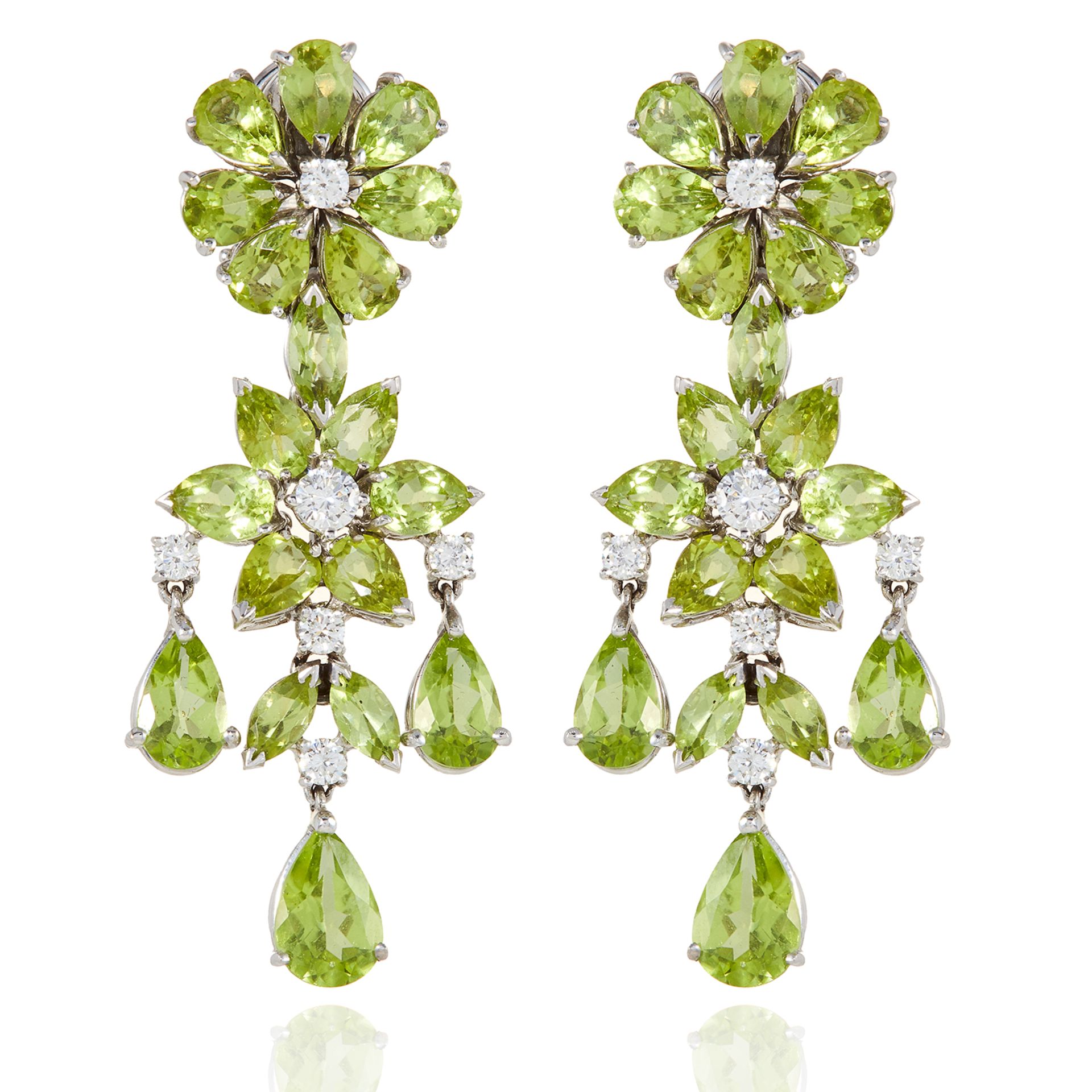 PERIDOT AND DIAMOND EARRINGS in foliate design, set with pear cut peridot and round cut diamonds,