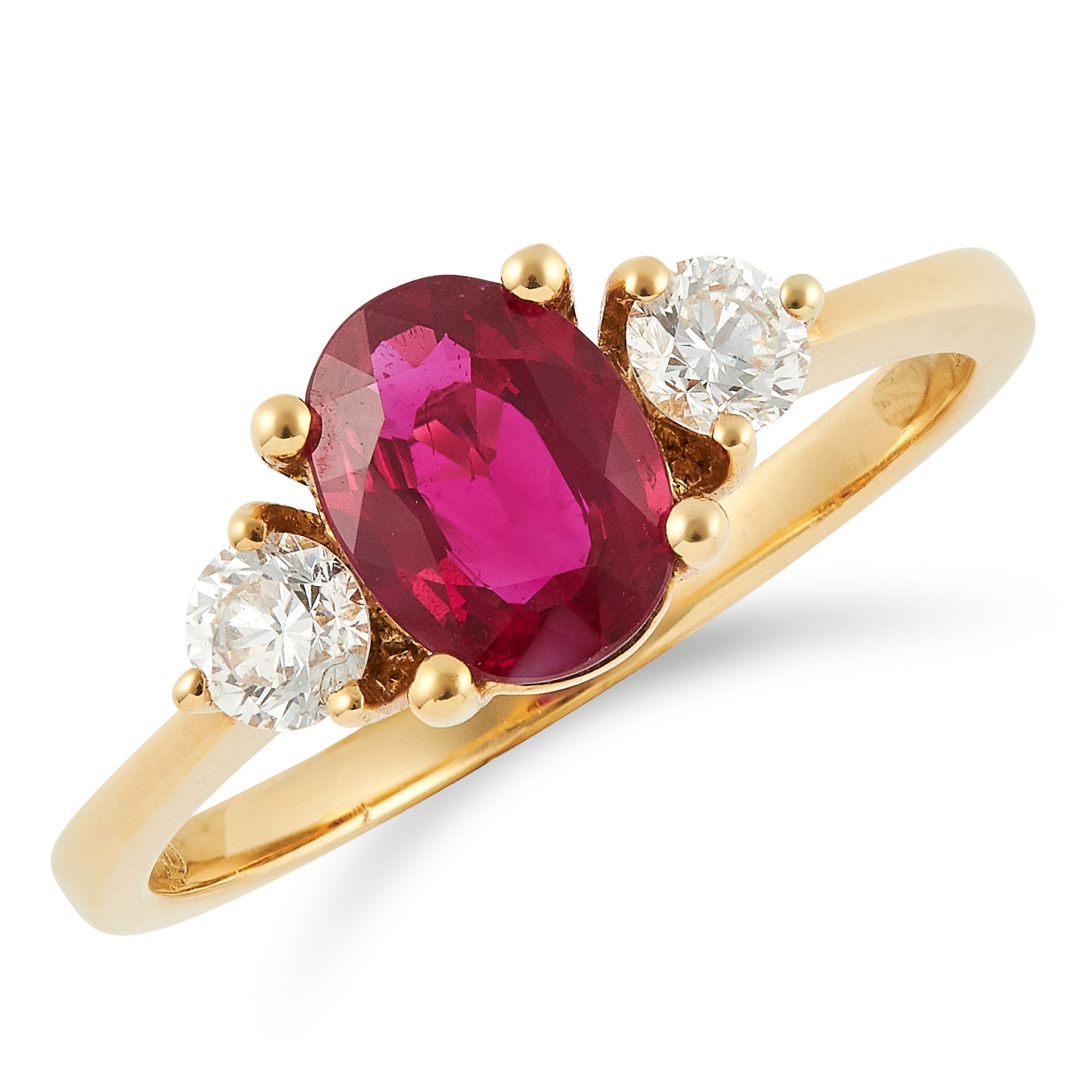 RUBY AND DIAMOND THREE STONE RING set with an oval cut Burmese ruby between two round cut