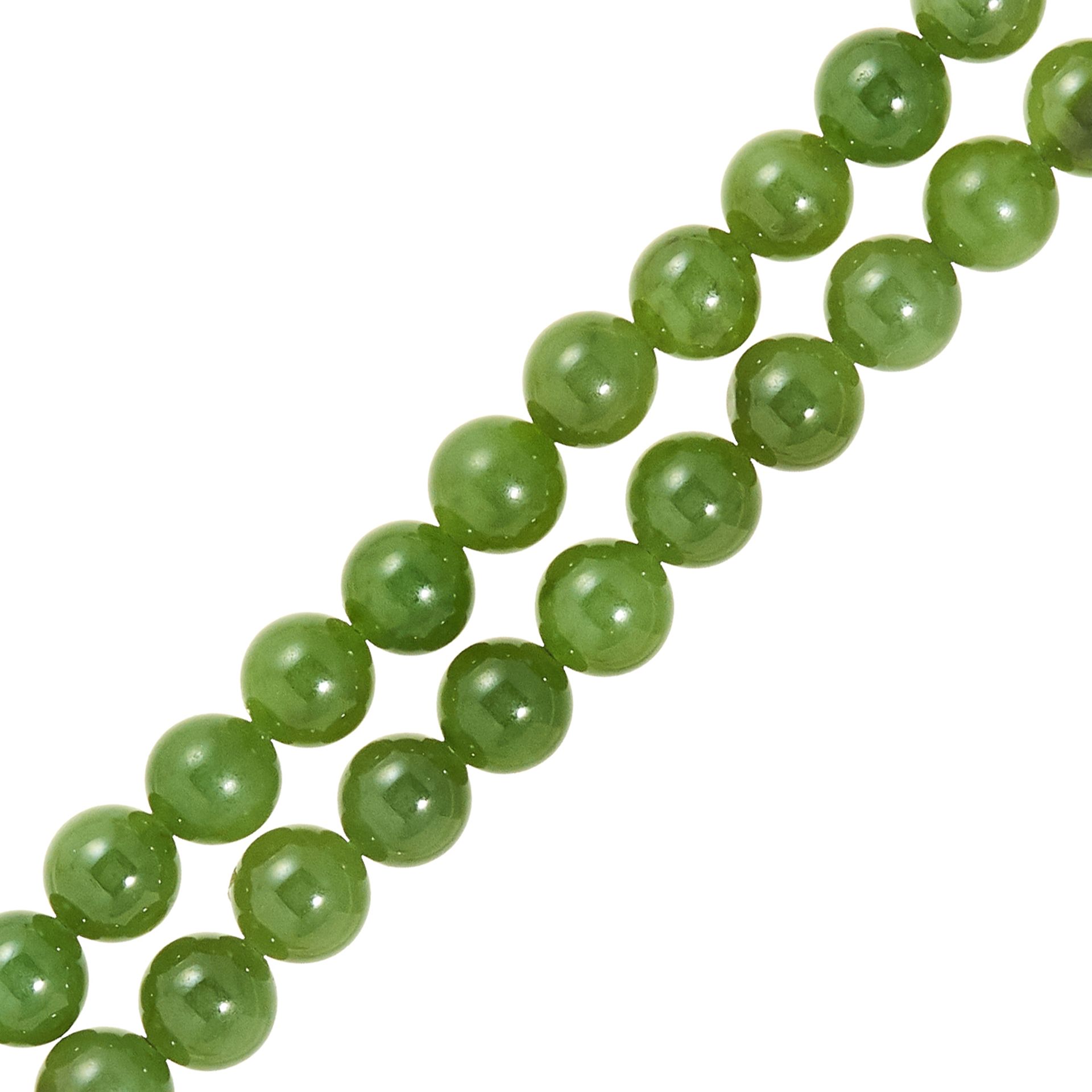 JADE BEAD BRACELET comprising of two rows of polished jade beads, 17cm, 31.81g. - Image 2 of 2