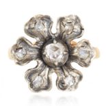 A DIAMOND RING depicting a flower set with rose cut diamonds, 4.52g.