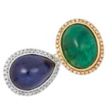 SAPPHIRE, EMERALD AND DIAMOND RING set with a cabochon sapphire and emerald in a border of round cut