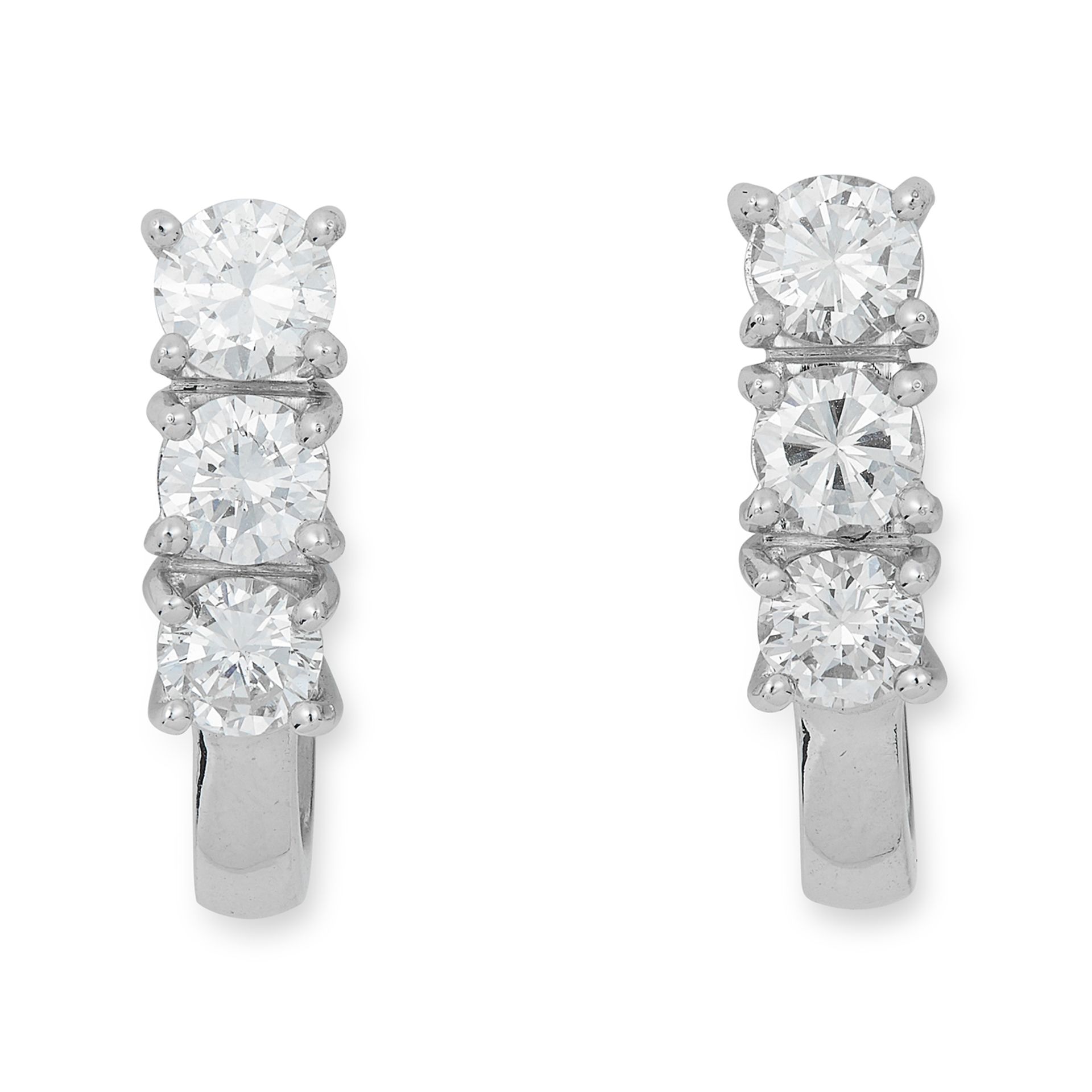 DIAMOND EARRINGS each set with three round cut diamonds, 5.7cm,