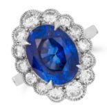 5.96 CARAT SAPPHIRE AND DIAMOND CLUSTER RING set with an oval cut sapphire of approximately 5.96