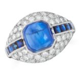 A SAPPHIRE AND DIAMOND RING set with a sugarloaf cabochon sapphire of 3.80 carats within a row of