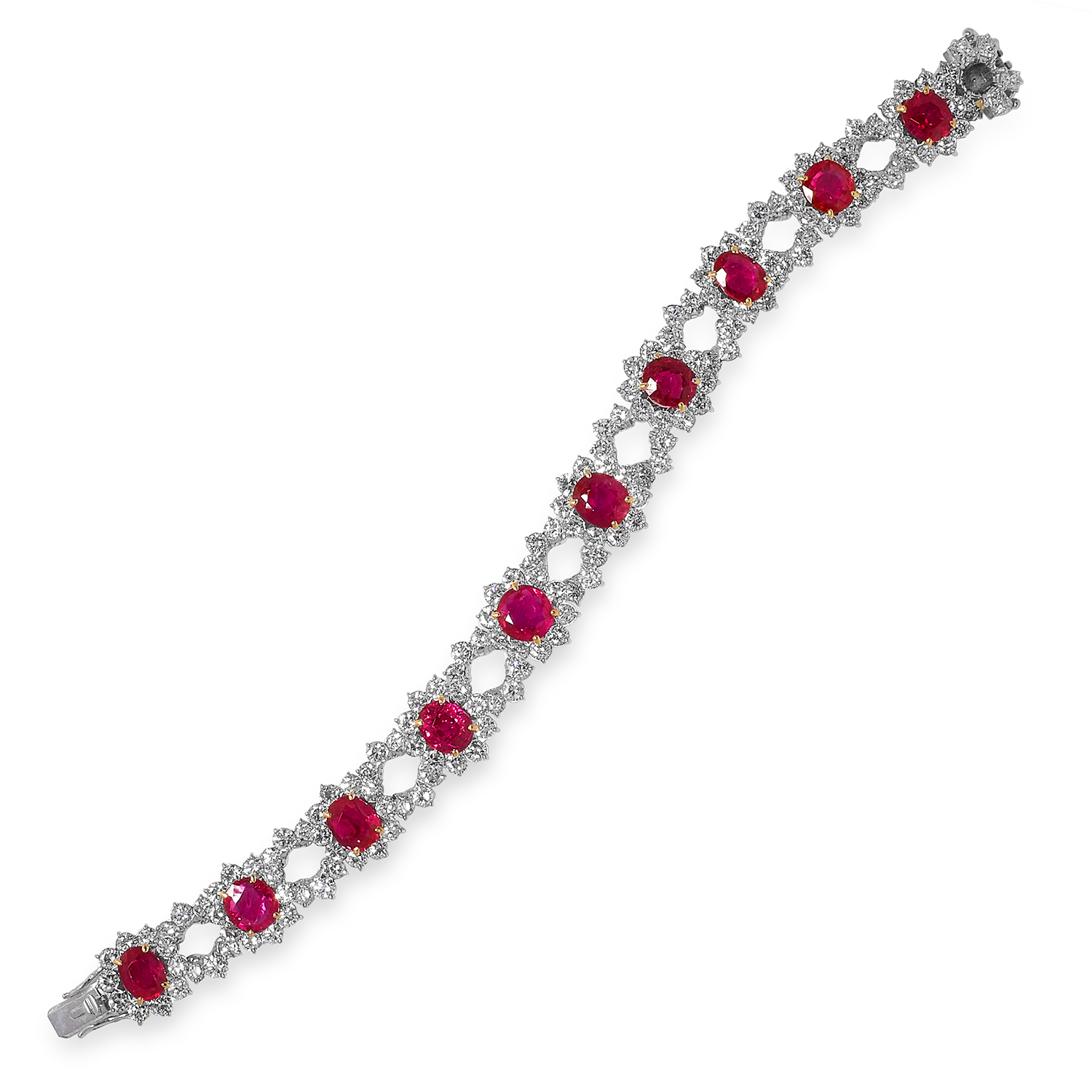 AN IMPORTANT BURMA NO HEAT RUBY AND DIAMOND BRACELET comprising a row of alternating cluster and