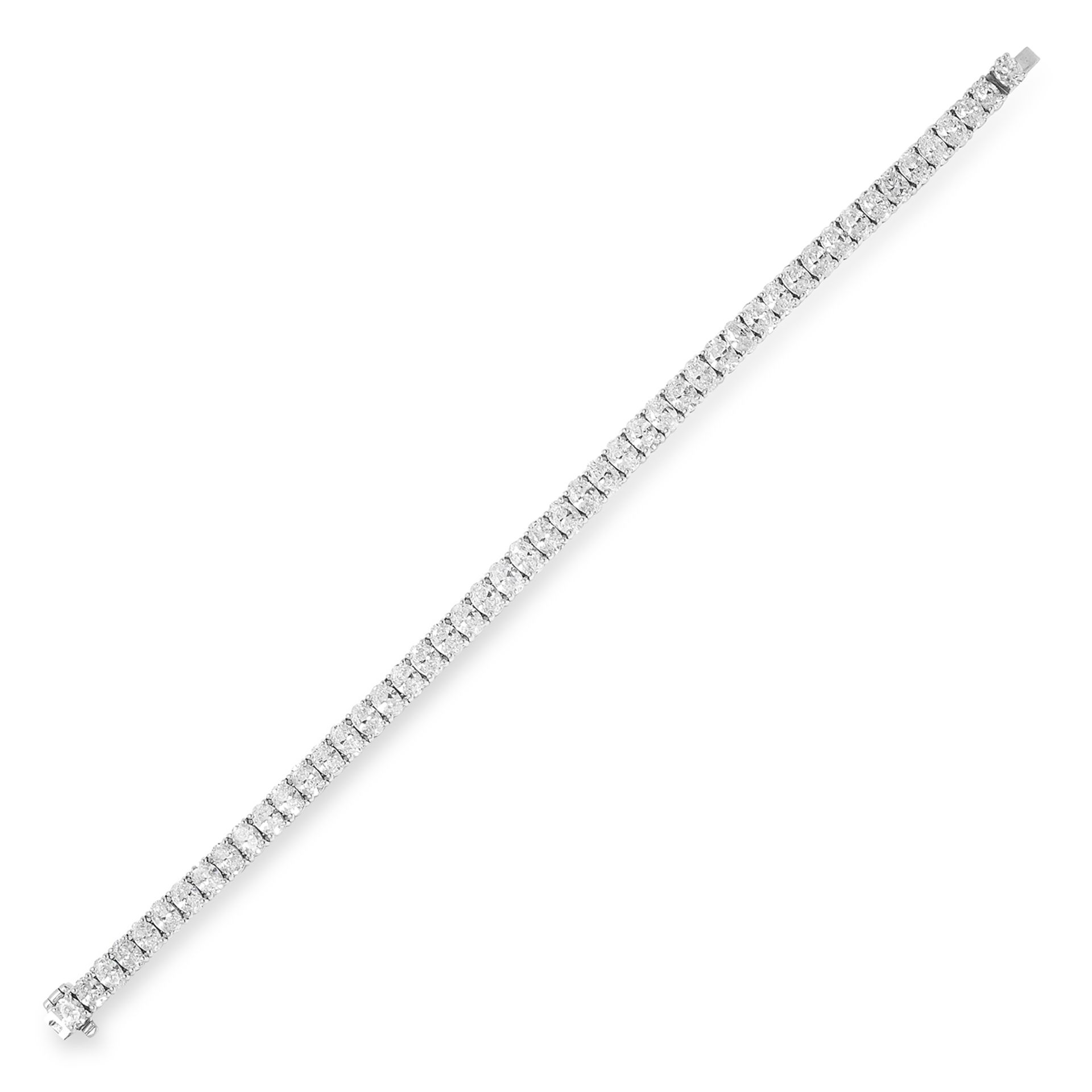 A DIAMOND LINE BRACELET comprising a single row of forty-nine graduated oval cut diamonds