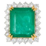 A 22.37 CARAT EMERALD AND DIAMOND CLUSTER RING comprising of an emerald cut emerald of 22.37