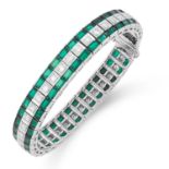 A EMERALD AND DIAMOND LINE BRACELET set with a row of round cut diamonds between two rows of