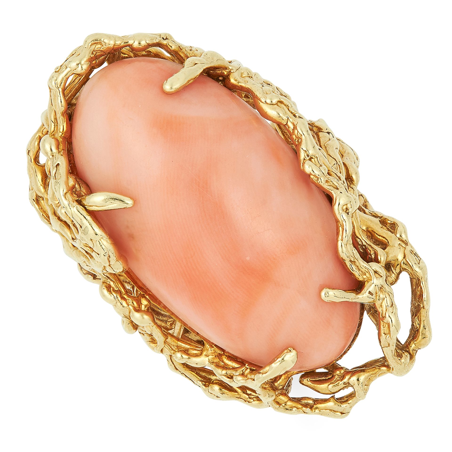 A VINTAGE CORAL RING, CIRCA 1970 in abstract naturalistic design set with an oval coral cabochon