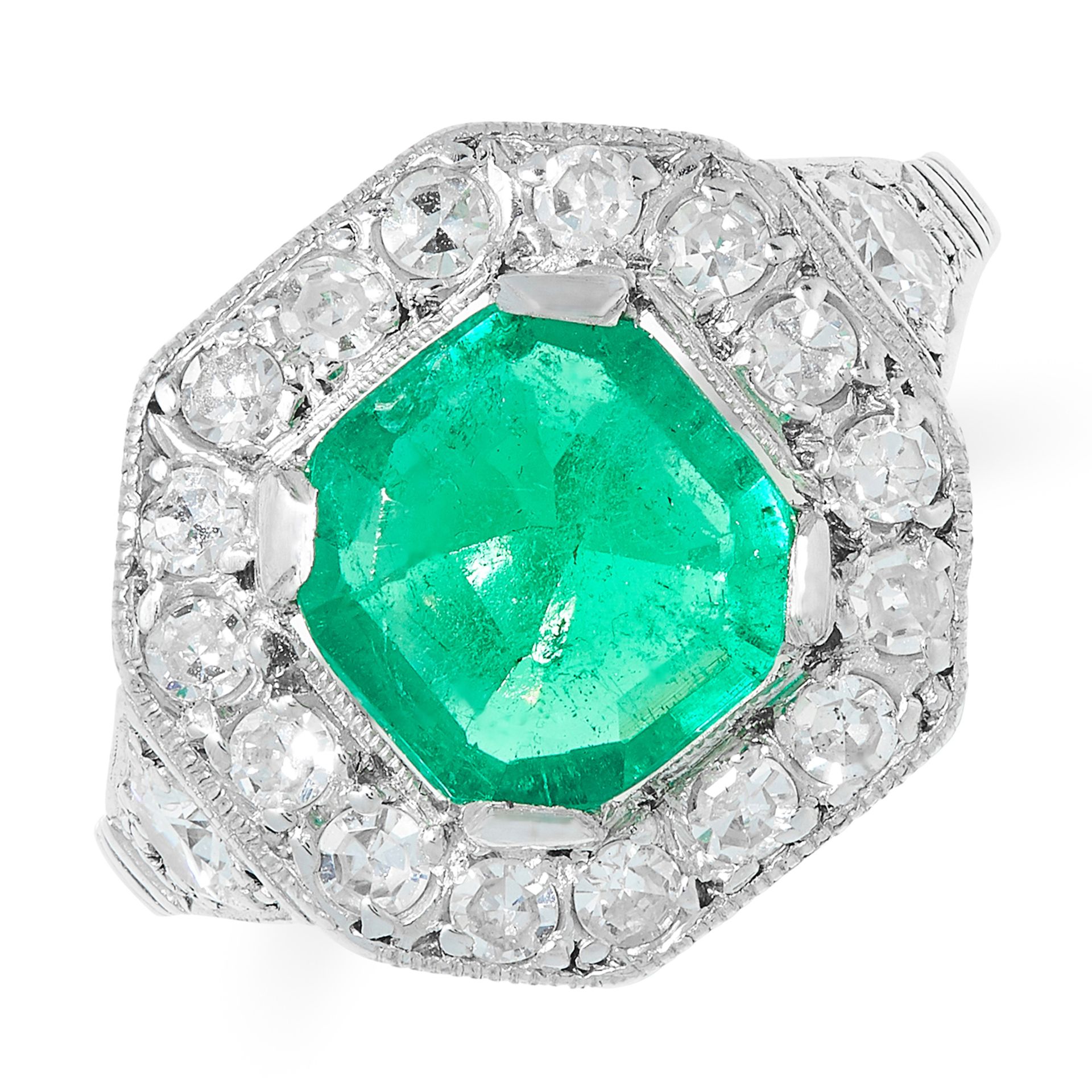AN ART DECO COLOMBIAN EMERALD AND DIAMOND RING set with an emerald cut emerald of 1.42 carats within