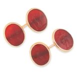 A PAIR OF ANTIQUE CARVED INTAGLIO SEAL CUFFLINKS set with oval carnelian panels reverse carved to