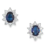 A PAIR OF SAPPHIRE AND DIAMOND CLUSTER EARRINGS set with oval cut sapphires in clusters of round cut