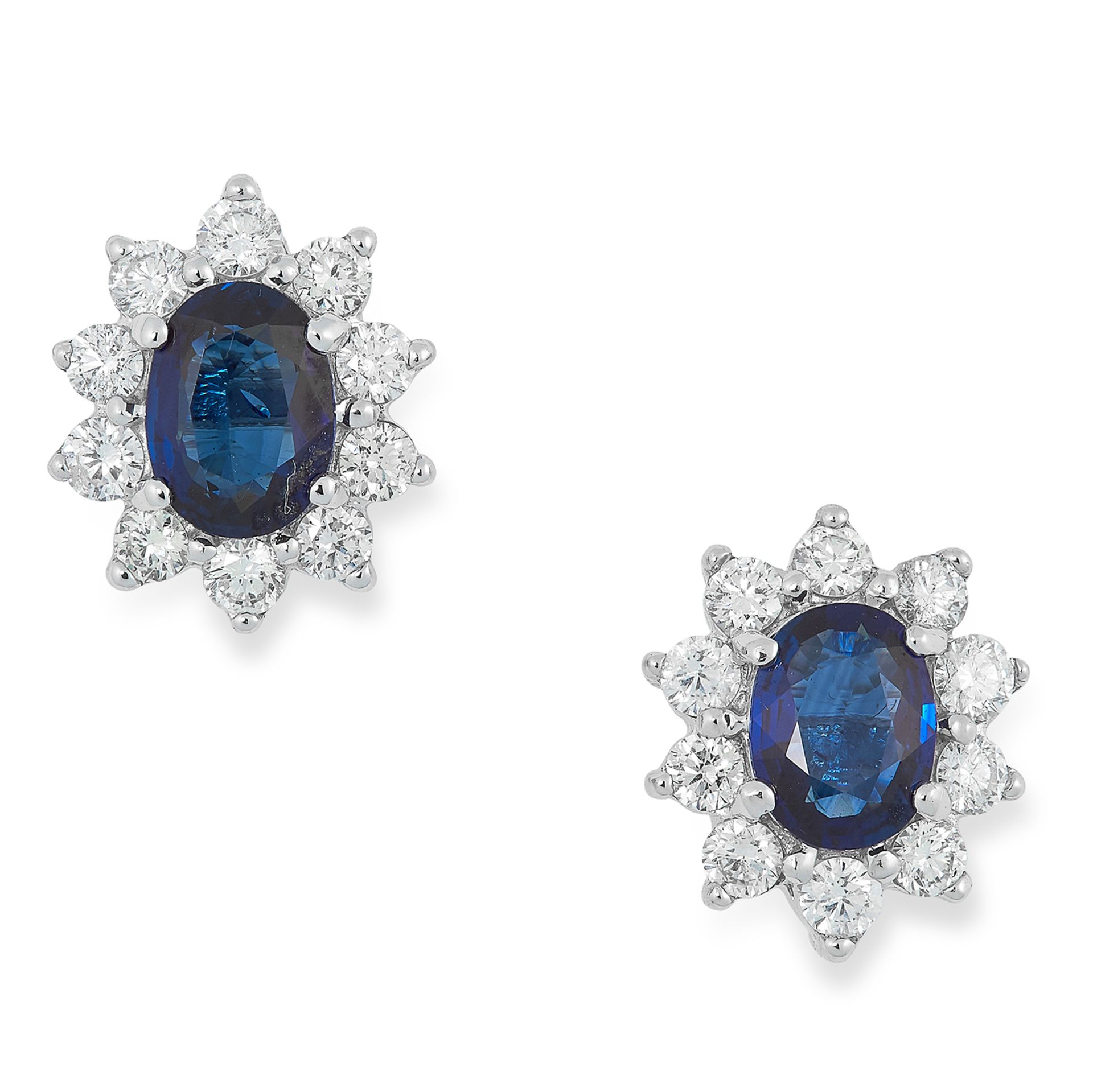 A PAIR OF SAPPHIRE AND DIAMOND CLUSTER EARRINGS set with oval cut sapphires in clusters of round cut