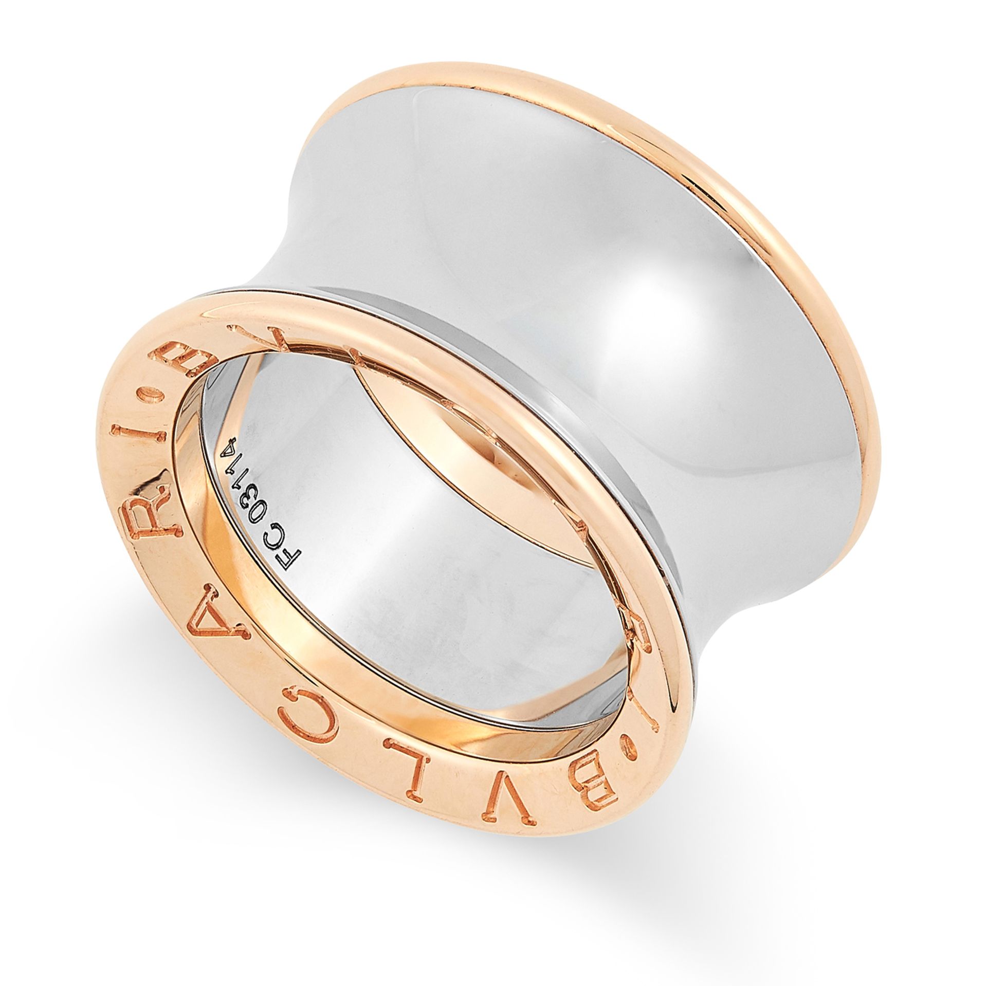 A TURBO RING, BULGARI the concave body in two tone gold, signed Bvlgari size K / 5, 10g.