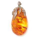 RUSSIAN AMBER PENDANT formed of an amber drop in a silver setting, 4cm, 5.9g.